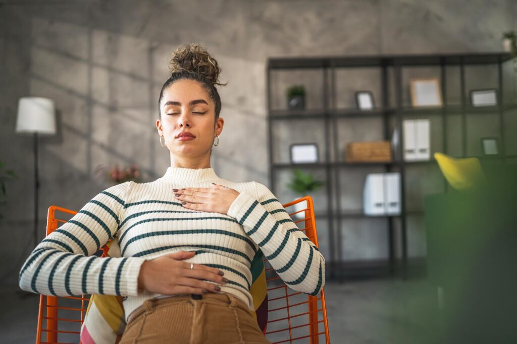 one woman adult caucasian female meditate millennial meditation practicing mindfulness yoga with eyes closed at home real people self care concept copy space